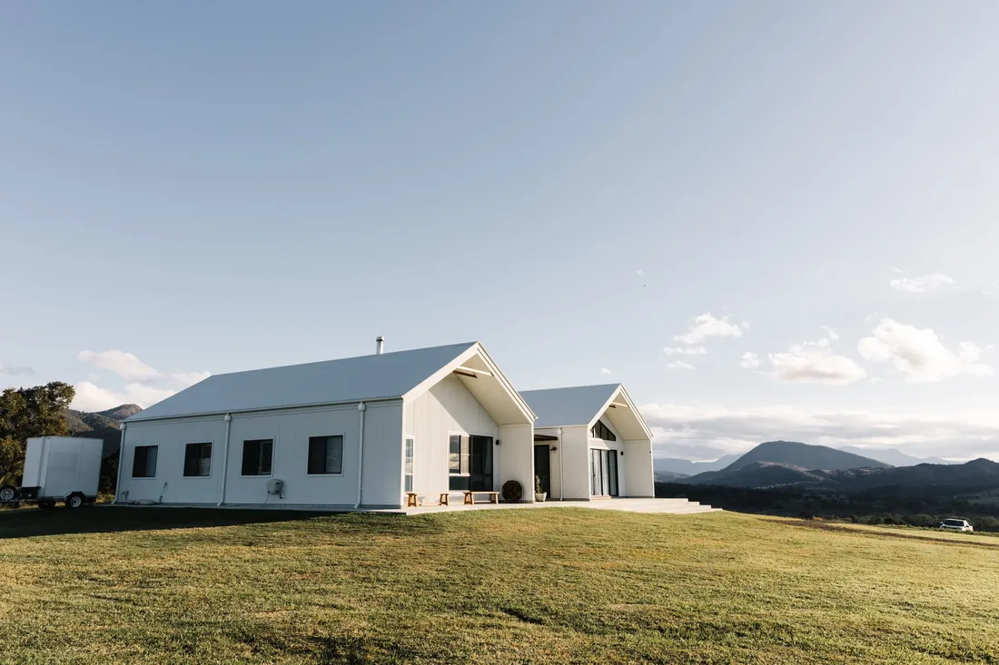 Maroon Hill Estate venue building exterior in daylight, with mountains in the background