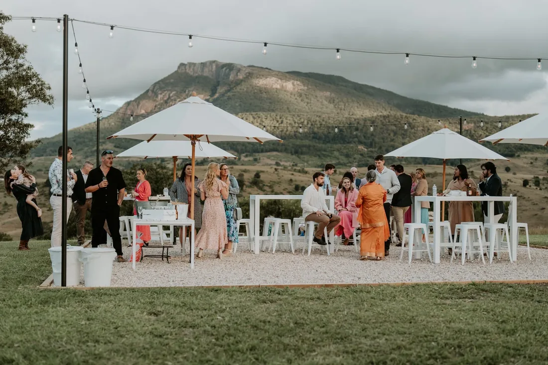 Cocktail hour under festoon lighting with Mount Maroon in the background
