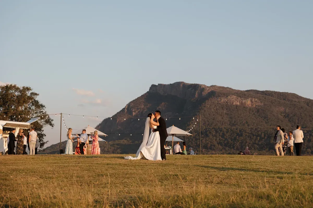 The Vista, with Mount Maroon rising behind the lawn at golden hour
