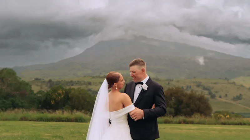 Deanna and Michael with a storm gathering over the ranges behind them