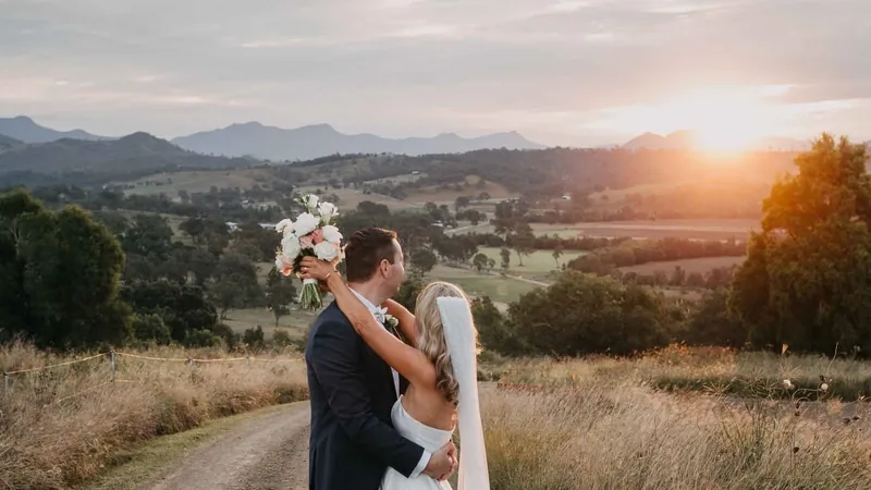 Kaitlin and Ben at golden hour, the Scenic Rim ranges behind them